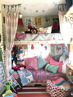 a room filled with lots of colorful furniture and decor on top of carpeted flooring