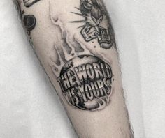 a man's arm with a tattoo on it that says the world is yours