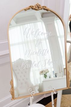 there is a mirror that says welcome to the bridal show