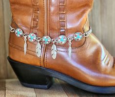 Southwestern Tribal boot jewelry, Western cowboy boot bracelet, boot bling.  This boot bracelet is made with southwestern color enameled connectors linked together.  Two large and two small stainless-steel feathers adorn the links between the connectors.  The total length of the bracelet is approximately 16 inches long.  It's adjustable to fit most boots and closes with a sturdy lobster claw clasp.  The chain is a medium gauge stainless steel curb chain.   This bracelet is ready to ship.  **List Boot Jewelry Fringe, Boot Jewelry Short, Boot Jewelry Bling, Boot Jewelry Low, Boots Bracelets, Boot Bracelet Chic, How To Make Boots, Rodeo Jewelry, Boot Bracelet