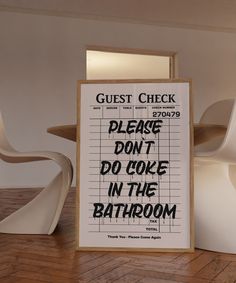 a sign that reads guest check please don't do coke in the bathroom next to some chairs