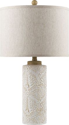 a white table lamp with a beige shade