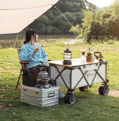 a man sitting in a chair next to a picnic table