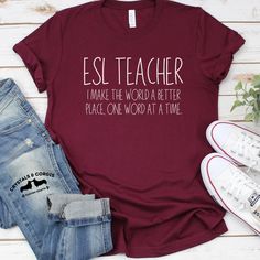 a t - shirt that says esl teacher make the world a better place one word at a time