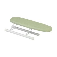 an ironing board with a green cover on it