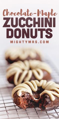 chocolate - maple zucchini donuts with white icing on a cooling rack