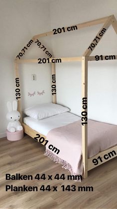 a bed frame with measurements for the size and width of it in front of a white wall