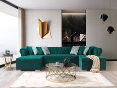 a living room with a green couch and coffee table in front of a large window