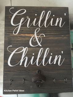 a wooden sign with the words grillin and chillin written in white on it