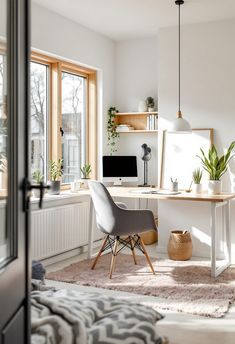 a living room filled with furniture and lots of windows next to a window sill