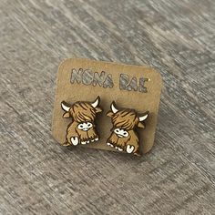 Introducing our Highland Cow Wooden Earrings, a unique addition to your jewelry collection. These earrings are laser cut and hand painted, showcasing intricate details that make them stand out. Crafted from lightweight materials, they are designed to be comfortable and easy to wear for extended periods of time. Perfect for those with sensitive skin, these earrings are hypoallergenic and free from lead and nickel - ensuring no irritation or discomfort during wear. Don't miss out on these charming accessories that add a touch of rustic flair to any outfit! Highland Cow Jewelry, Awesome Earrings, Cow Stuff, Cow Earrings, Christmas Lists, Country Birthday, Fluffy Cows, Country Stuff, Cute Small Animals