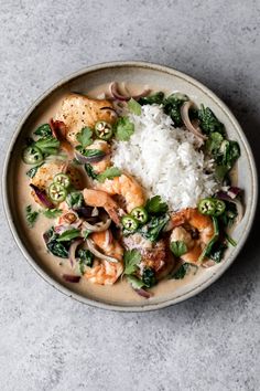 a white bowl filled with shrimp and rice