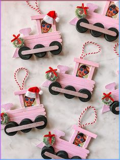 pink wooden train ornament with santa's hat and sunglasses on the front