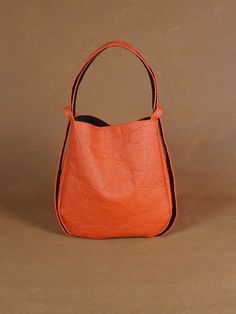 Circlebag Piñatex BRIGHT RED | Etsy Modern Orange Shoulder Bag With Adjustable Strap, Modern Orange Everyday Shoulder Bag, Modern Orange Shoulder Bag For Travel, Modern Everyday Leather Bucket Backpack, Modern Orange Everyday Bag, Modern Orange Everyday Bags, Functional Hobo Tote Bag With Detachable Strap, Functional Hobo Bag With Detachable Strap And Tote Shape, Orange Satchel Bucket Bag For Daily Use