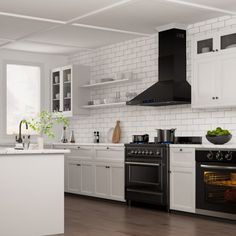 a kitchen with an oven, stove and counter tops in white painted wood flooring