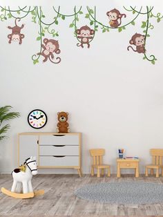 a child's room with monkey wall decals and rocking horse in the foreground