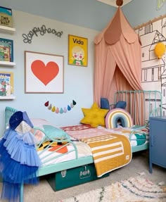 a child's bedroom decorated in pastel colors