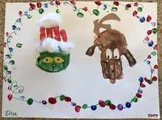 two handprints depicting santa and reindeer on paper