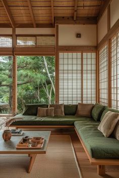 a living room filled with furniture and lots of windows