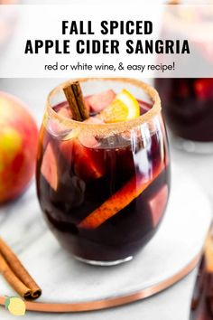 fall spiced apple cider sangria in a glass with cinnamon stick garnish