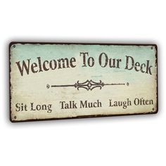 a sign that says, welcome to our deck sit long talk much laugh often on