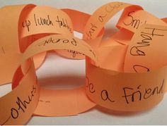 several pieces of orange paper with writing on them