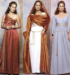 three women dressed in ancient greek costumes, one wearing a veil and the other wearing a gown