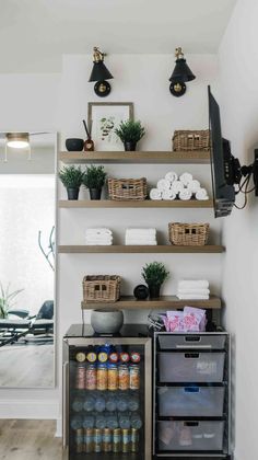 the shelves in this kitchen are filled with bottles and other things to put on them