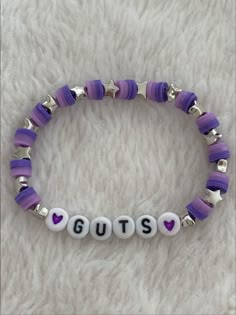 NOT MY PHOTO!! ❌ Guts Your Bracelets, Olivia Bracelet Ideas, Clay Need Bracelet Ideas, Olivia Rodrigo Guts Tour Bracelets, Themed Beaded Bracelets, Olivia Rodrigo Bracelet Ideas Clay Beads, Clay Bead Bracelet Ideas Olivia Rodrigo, Things To Put On Bracelets, Bracelet Ideas Olivia Rodrigo