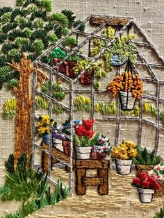 an embroidery pattern with potted plants and a bench in front of a house that is surrounded by pine trees