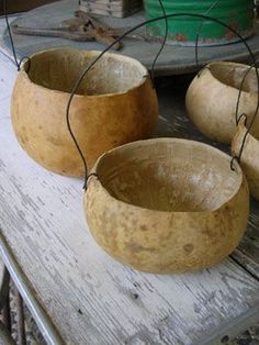 three wooden bowls sitting on top of a table