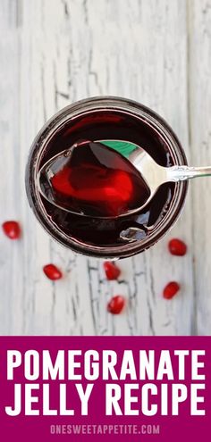 pomegranate jelly recipe in a jar with spoon