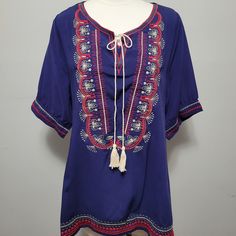 Effortless And Chic, The Perfect Pairing For Your Favorite Jeans Or Leggings. Blue With Red Embroidery Tassel Tie Tunic. Size Large 20" Bust 29" Length 100% Cotton Dry Clean Blue Beach Tops With Tassels, Beach Blue Tops With Tassels, Blue Tassel Tops For Beach, Blue Tassel Tops For Summer, Blue Bohemian Tops With Tassel Ties, Blue Bohemian Top With Tassel Ties, Blue Beach Tops With Tassel Ties, Bohemian Blue Tops With Tassel Ties, Blue Tops With Tassel Ties For The Beach