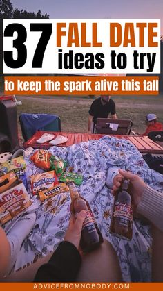 two people sitting at a picnic table with snacks and drinks in front of them text reads, 37 fall date ideas to try to keep the spark alive this fall