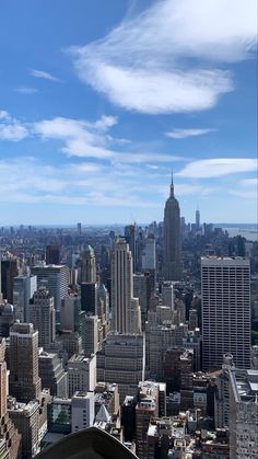 an aerial view of new york city with the empire building in the background