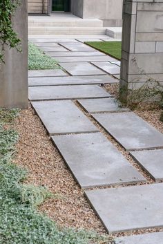 an open door leading into a courtyard with stone walkways