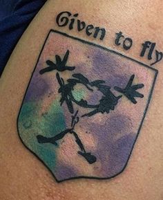 a tattoo with the words given to fly on it