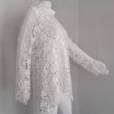 Stunning! Crochet Lace Top With Long Sleeves And Mock Turtleneck, Back Loop Button Closure. Great For A Special Occasion Or Date Night. Wear White On White And Colorful Accessories For A Chic Look. Will Fit A Size 14 To 16 Measuring Ptp 21" Elegant Crochet Lace Top For Brunch, White Crochet Lace Top For Party, Elegant Lace Crochet Top For Fall, Elegant Fall Lace Crochet Top, Elegant Long Sleeve Crochet Top For Spring, White Lace Top For Spring Party, Spring Party Lace Top With Crochet Detail, Spring Party Lace Top With Crochet Lace, Elegant Lace Crochet Top For Spring