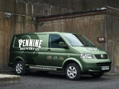 a green van parked in front of a building with the name pennne brewery on it