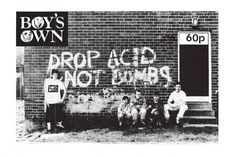 the boys are posing for a photo in front of a brick building with graffiti on it