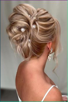 Elegant twisted updo accented with pearls gives a sophisticated and timeless charm for special occasions. The dimensional blonde tones highlight the intricate styling of this chic and classic hairstyle.  // Photo Credit: Instagram @coversbridalcouture Modern High Updo Hairstyles, Classic Low Bun, Gorgeous Wedding Hairstyles, Shiny Black Hair, Cute Wedding Hairstyles, Blonde Updo, Regal Elegance, Mother Of The Bride Hair, Hairdo Wedding