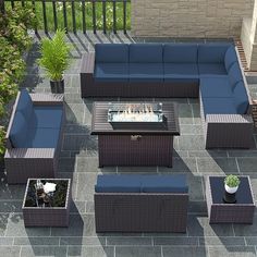 an outdoor patio furniture set with blue cushions