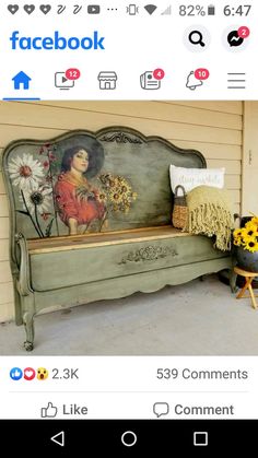 an old bench is decorated with flowers and a painting on the side of it that says facebook