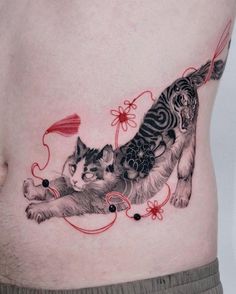 a man's stomach with two cats on it