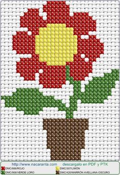 a cross stitch pattern with a red flower in a pot on the bottom and yellow center