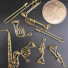 brass musical instruments and a penny on a table