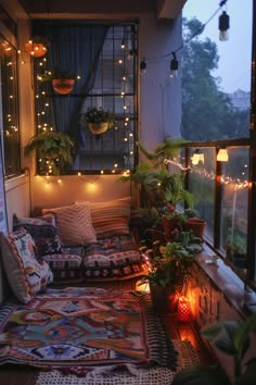 Cozy small balcony design illuminated by string lights, featuring a rich mix of textiles and lush plants, creating a warm, inviting outdoor space. Corridor Decor Ideas Small Spaces, Small Balcony Inspiration, Small Patio Ideas Apartment Tiny Balcony, Mini Balcony Ideas Apartment, Small Balcony Design Apartments, Mini Balcony Ideas, Bed Balcony, Corner Balcony, Relaxation Corner