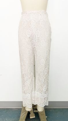 Mod 1960s handmade lace pant set - Skinny strap white lace tunic with sweetheart neckline and scalloped hem. Metal zipper on the back with hook-and-eye closure at top. Fully lined with blush fabric and nude overlay. - Cropped straight leg high-rise white lace pants with scalloped hem. Side metal zipper and hook-and-eye closure on tab. Fully lined in blush fabric with nude overlay. Label: Fashioned by Ruth Steele Elegant Scalloped Lace Bottoms For Party, Feminine Cream Wedding Bottoms, Feminine Cream Bottoms For Wedding, Lace Wedding Bottoms For Summer, Elegant Lace Pants For Summer, Elegant Scalloped Lace Bottoms, Spring Wedding Bottoms With Lace Trim, Chic Lace Bottoms For Wedding, Chic Lace Bottoms With Scalloped Lace