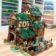 a toy house made out of legos on the floor