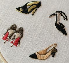 embroidered shoes and heels are shown on a piece of fabric that has been stitched together